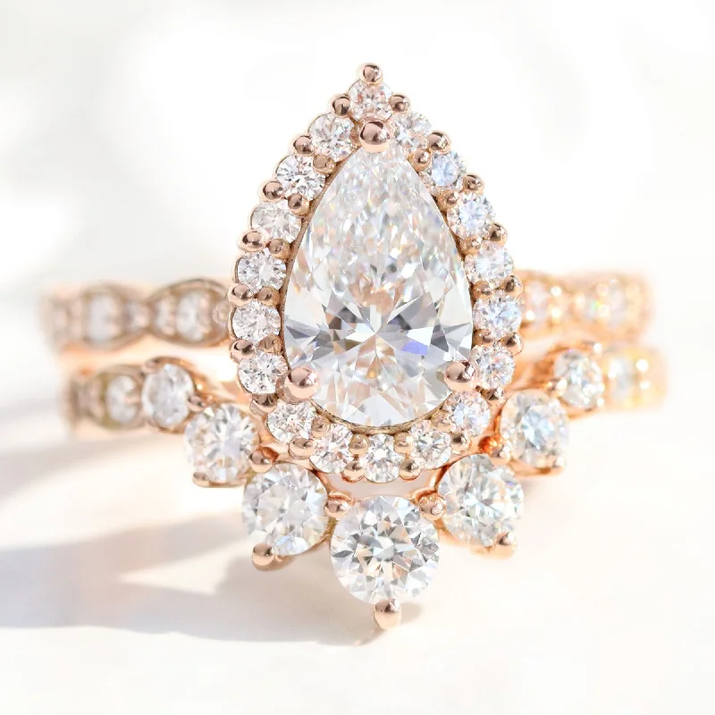 Art Deco - Inspired Women's Diamond Rings with Geometric Designs and Baguette - Cut Diamonds2.37 Ct Pear Diamond Halo Ring Set w/ Lab Diamond and Large 7 Stone Scalloped Band