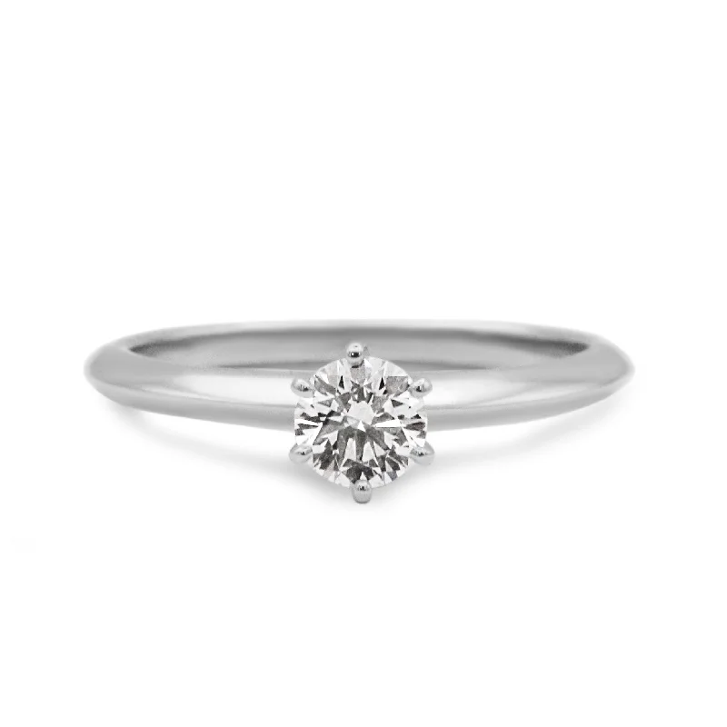 Halo - Style Women's Diamond Rings with a Center Diamond Surrounded by Smaller Diamonds in 18K GoldTiffany & Co. Solitaire 0.45ct Diamond Ring - Platinum