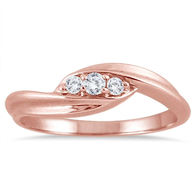 Halo - Style Women's Diamond Rings with a Center Diamond Surrounded by Smaller Diamonds in 18K GoldMarquee 1/8 Carat TW Diamond Three Stone Ring in 10K Rose Gold