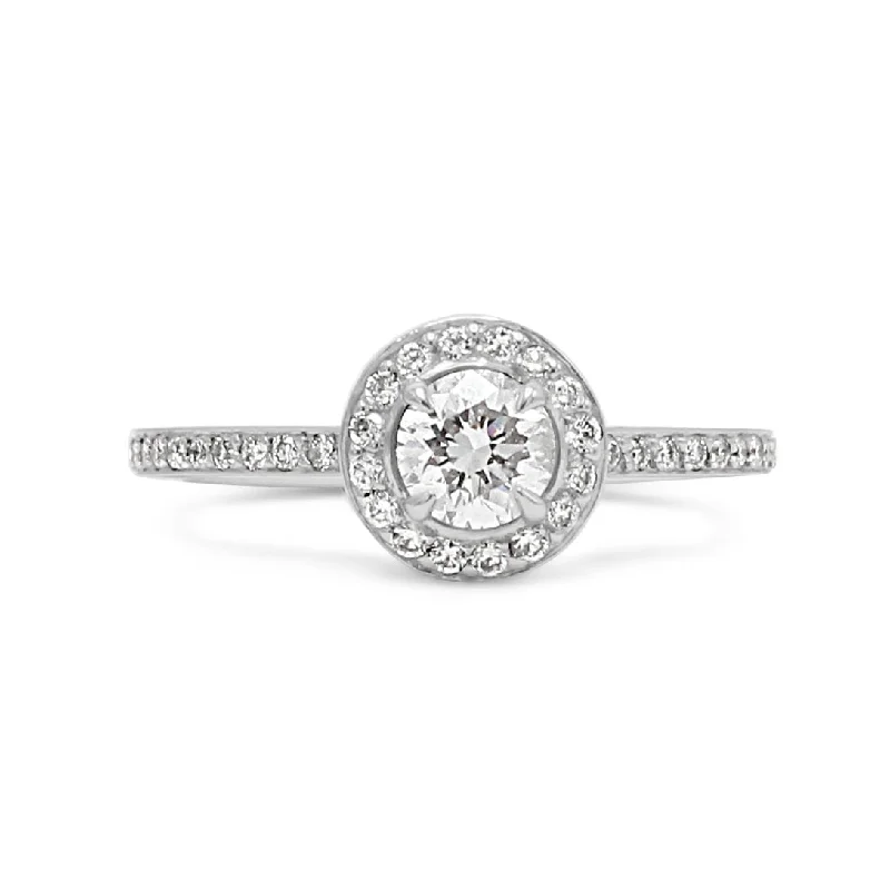 Halo - Style Women's Diamond Rings with a Center Diamond Surrounded by Smaller Diamonds in 18K GoldDiamond Halo Design Ring By Boodles - Platinum