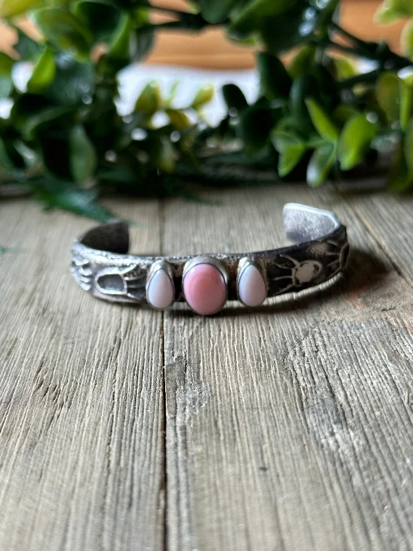 Women's Sterling Silver Cuff Bracelets with Engraved Floral Patterns for a Romantic LookWilson Dawes Pink Conch & Sterling Silver Tufa Cast Cuff Bracelet