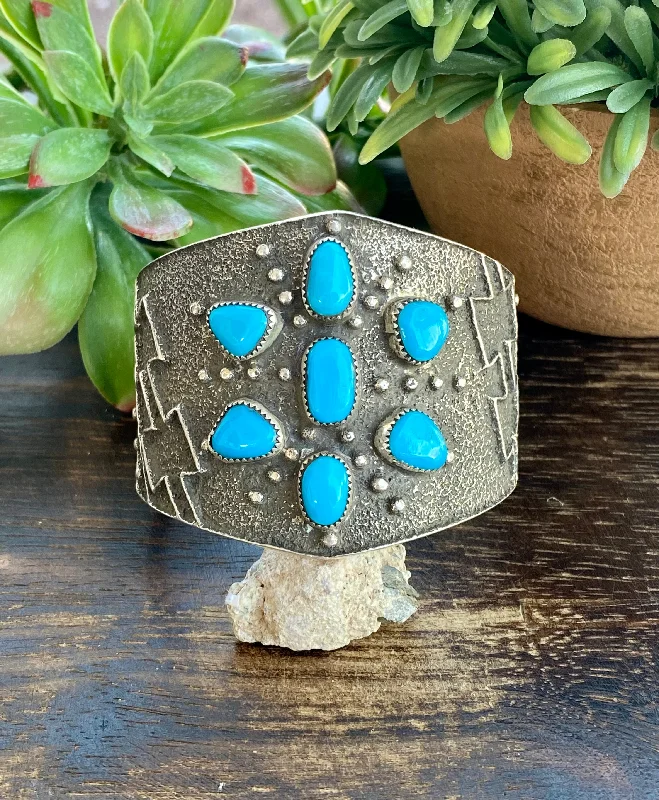 Wooden Women's Cuff Bracelets with Carved Motifs for a Natural and Artistic LookDelbert Arviso High Grade Sleeping Beauty Turquoise & Sterling Silver Tufa Cast Cuff Bracelet