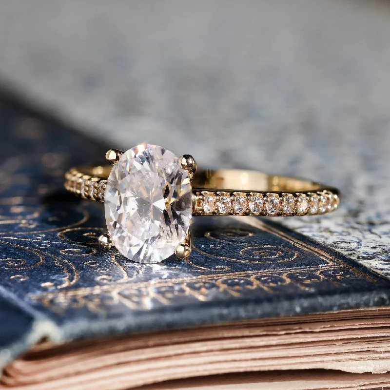 Cathedral - Style Engagement Rings with a Raised Center Stone and Intricate MetalworkThe Chloe - Oval Diamond Engagement Ring with Pavé Diamond Setting