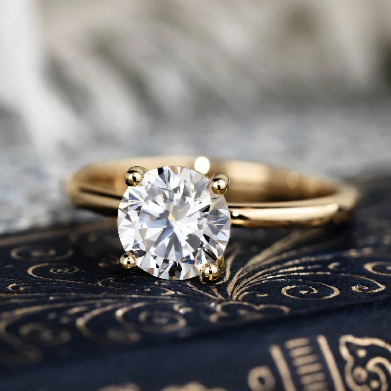 Art Deco Engagement Rings with Geometric Patterns and Baguette - Cut Diamond AccentsThe Lora - Round Solitaire Engagement Ring with Delicate Nature Inspired Setting