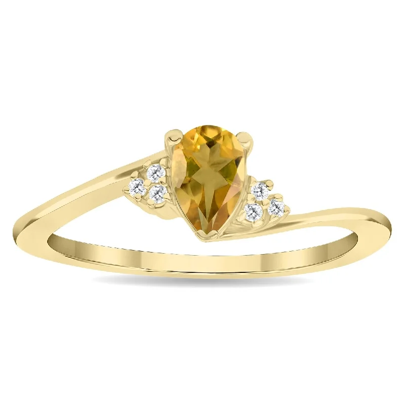 Iolite Gemstone Rings in 10K Gold with a Twisted Band for a Distinctive and Stylish AccessoryWomen's Pear Shaped Citrine and Diamond Tierra Ring in 10K Yellow Gold